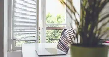 white and black striped chair near window