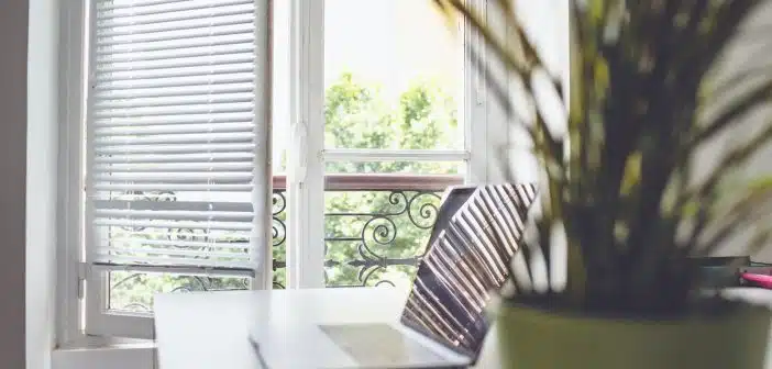 white and black striped chair near window